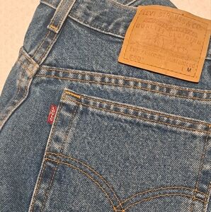 Levi's,550 size 14,straight tapered leg,high waisted, 32 in waist w/ 31 length